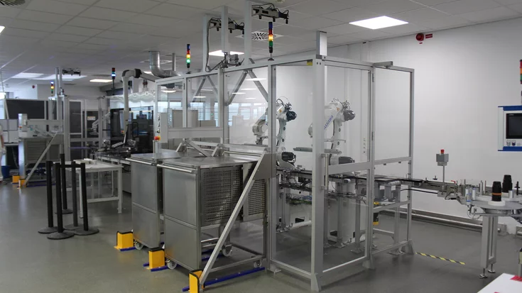 Automated robot cell handling vaccine vials with machine vision.